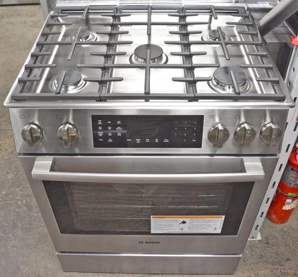 A close-up of a brand new Bosch Benchmark Series HDIP056U 30-Inches Slide-In Dual Fuel Range.